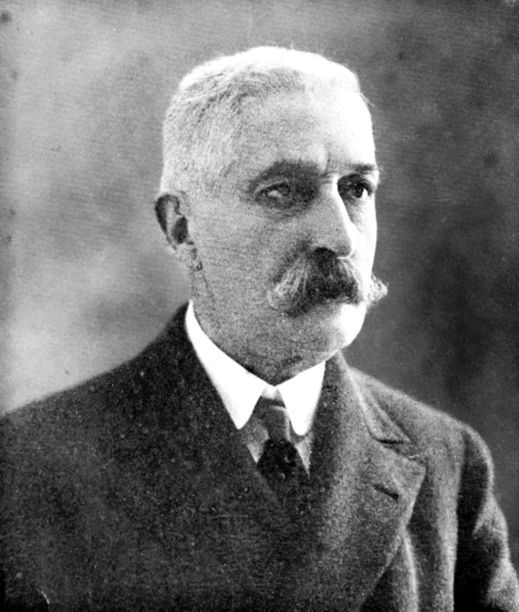 A black-and-white portrait photograph of the Italian novelist Giovanni Verga.